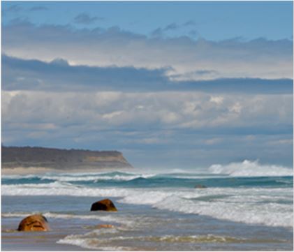 Beach view with cliff in the background1
